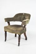 A Victorian buttonback armchair upholstered in green velour,