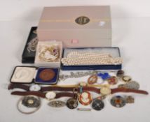 A selection of costume jewellery including gents watches, brooches and other items,