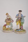 A pair of Dresden late 19th/early 20th century Continental porcelain figures,