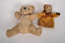 An early 20th century teddy bear, golden mohair, plastic eyes and nose and velvet paws,