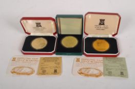 Three commemorative Isle of Man coins,