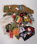 A collection of military and brigade cloth badges from various regiments and organisations