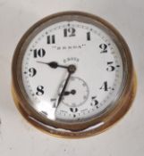 A car dashboard mounted clock, the dial inscribed 'Zenda',