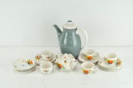 A Corona tea set including cups, saucers, plates and a teapot,