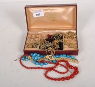 A collection of costume jewellery including necklaces, sleeve links and a cocktail watch,