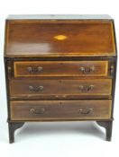 An early 20th century mahogany bureau with pale wood cross-band detail