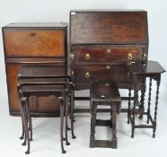 A selection of assorted furniture including an oak bureau, nest of three tables,