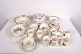 A quantity of Portmeirion ceramics, comprising mugs, plates, bowls and more,