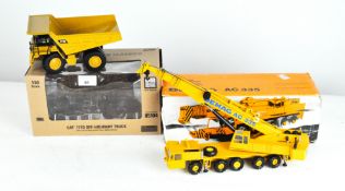 A CAT 1:50 scale CAT 777D off highway truck, 85104, together with a Demag AC335 1:50 scale, 2081,