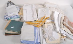 A quantity of table linen, comprising napkins, table cloths and place mats, in assorted colours,