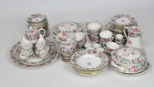A Crown Staffordshire tea and dinner service, printed floral decoration with gilt rims,