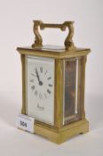 A Harrods brass cased carriage clock