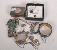 A collection of silver and white metal jewellery, including a Victorian engraved bangle,