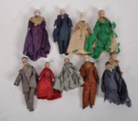 A collection of Victorian porcelain and bisque miniature dolls, male and female,