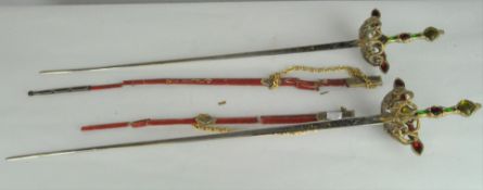 Two reproduction dress swords, each with jewelled metal handle,