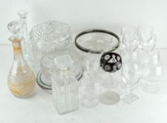 A box of vintage and modern glassware including serving dishes, glasses, candlesticks, decanters,