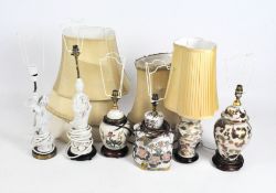 Six table lamps, two modelled as Asian figures in traditional attire glazed in white,