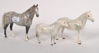 Three late 20th century Beswick horses, of assorted sizes and designs,