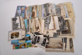 A box of 20th Century postcards,