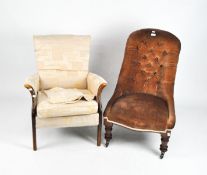 A Victorian button back armchair, upholstered in pink velvet, supported on turned mahogany legs,