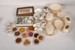 A collection of 19th & 20th century dolls house food and tea services of assorted sizes,