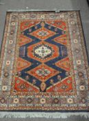 A Caucasian style rug, with geometric lozenge decoration,