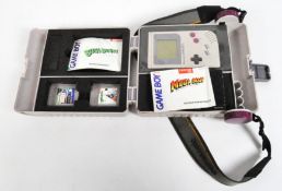 An original Nintendo Game Boy with Bugs Bunny and Soccer games, with instruction manual,