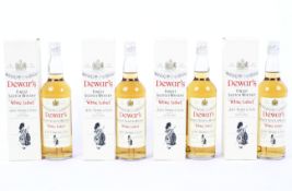Four bottles of Dewar's "White Label" Finest Scotch Whisky,