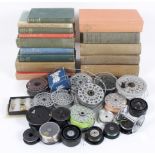 A large collection of mixed vintage fixed fishing reel spools to fit fly and f/s reels together