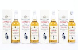 Four bottles of Dewar's "White Label" Finest Scotch Whisky,