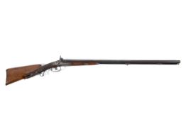 A double barrel 20 gauge percussion shot gun with ornate carved stock,