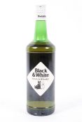 A vintage bottle of Black & White Choice Old Scotch Whisky, distilled,