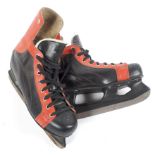 A pair of vintage JOFA ice skates, in black and red leather, the blades 11"/280mm, marked size 43,