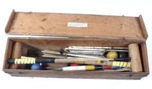 A vintage croquet set, including four mallets stamped 'Holburn',