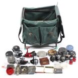 A seat box with a bag of fixed spool and fly fishing reels and tackle,