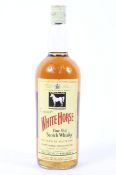 A vintage bottle of White Horse Fine Old Scotch Whisky,