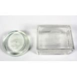 An engraved Caithness glass box and cover and a circular paperweight,