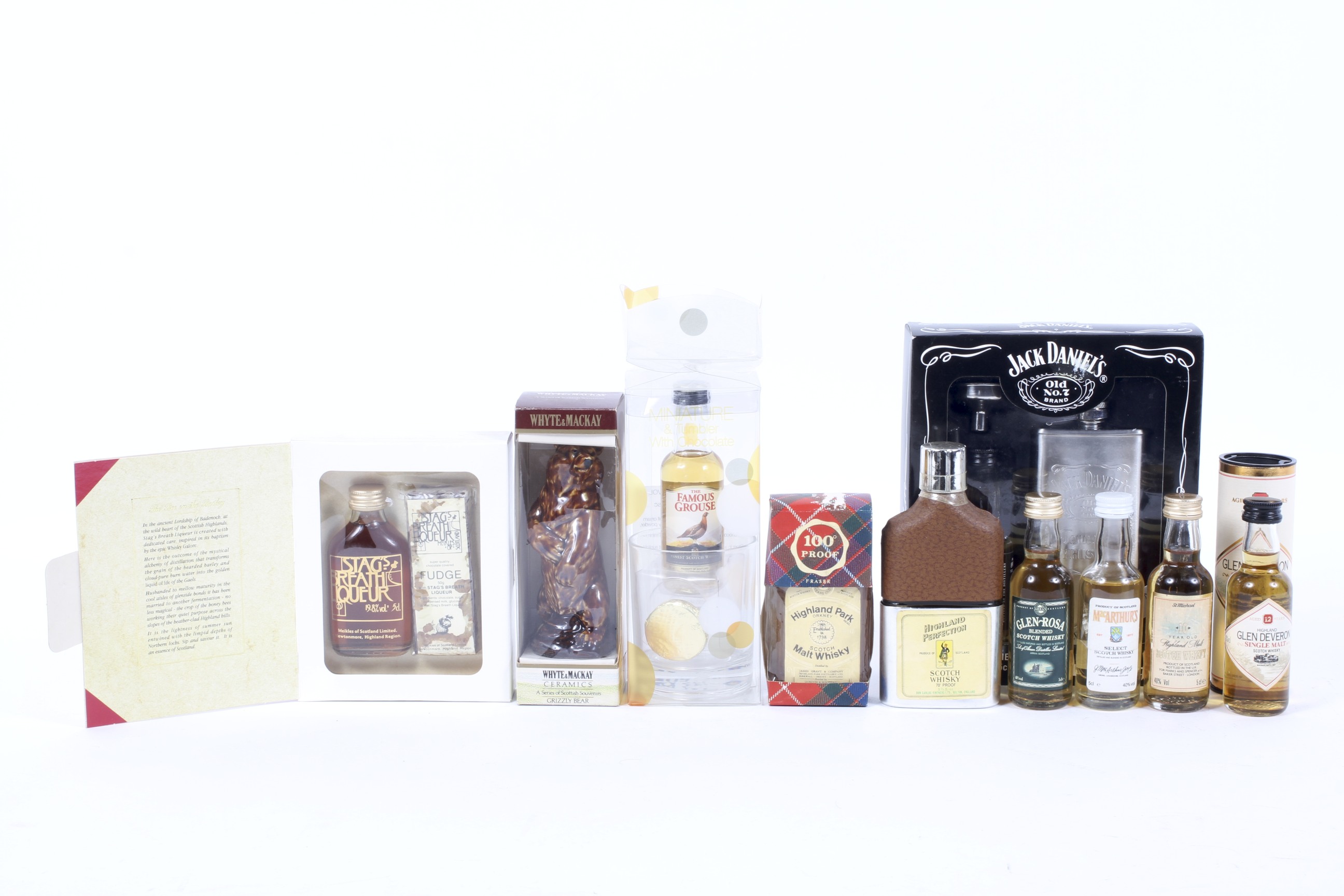 A group of miniatures including a Whyte & Mackay ceramic Grizzly Bear, 5 cl., 40% Vol.