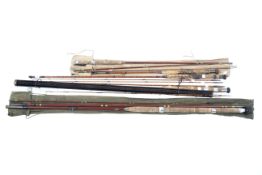 A bundle of assorted split cane and glass rods and rod sections including examples by Ogden Smith