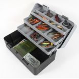 A sea tackle box with weights, hooks lures and other accessories,