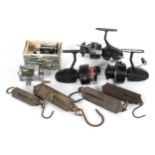 A box of fixed spool and multiplier reels to include Mitchell 300S,