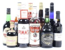 A collection of assorted alcohol, including Harvey's Bristol Cream, Martini Bianco,