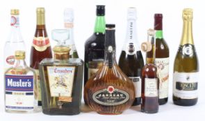 A collection of alcohol, including: Janneau Grand Armagnac, 70 cl, 40% Vol, two bottles of Oyzo,