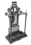 A cast metal 'Footballer' stick stand, with two removable inserts, with brass finial's,