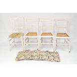 Four vintage painted white chairs, three with wicker seats,