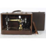 A Singer 128 hand crank sewing machine,