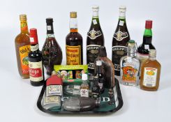 A collection of assorted alcohol and other wares, including glass hip flasks, a novelty corkscrew,