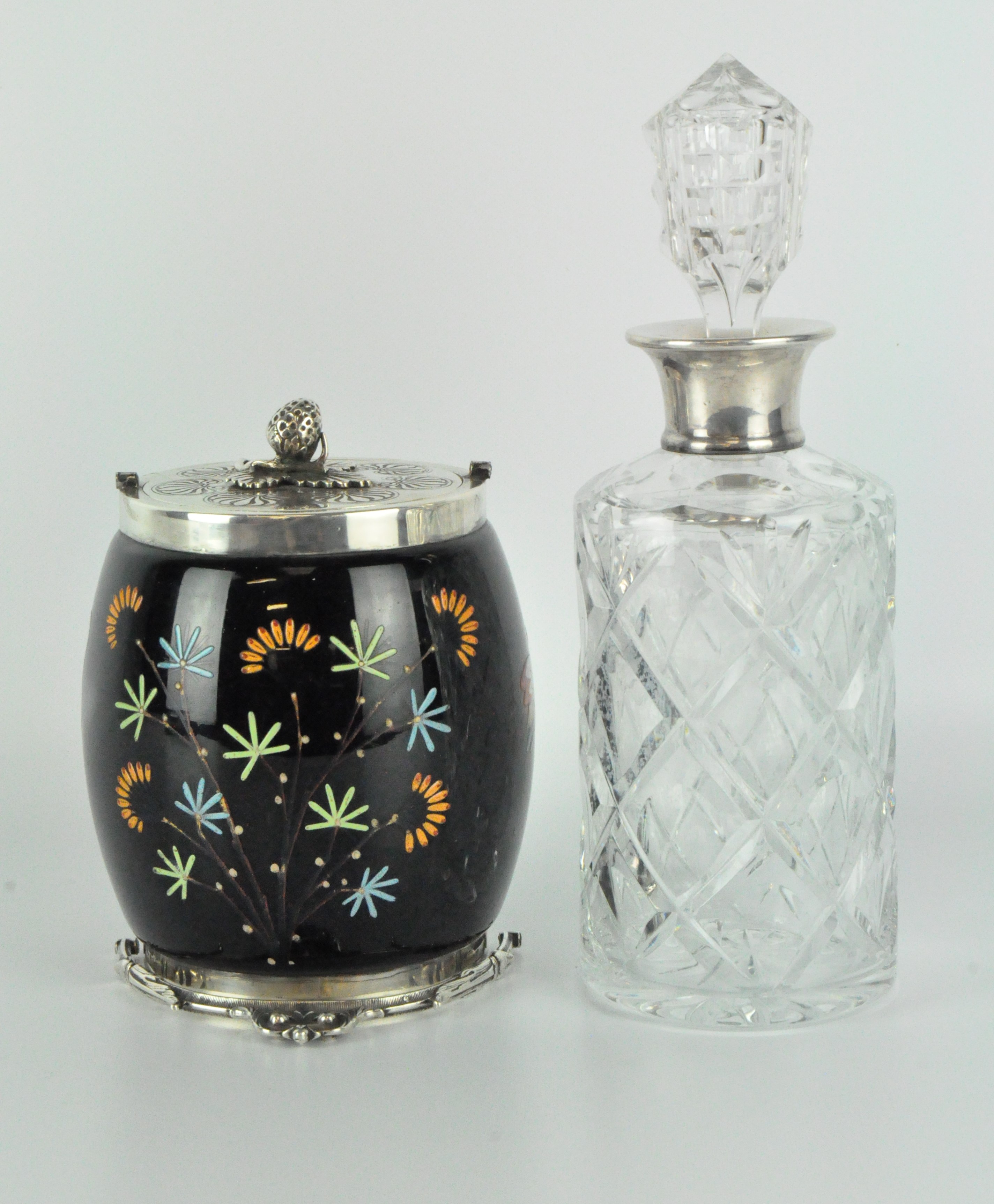 A early 20th century silver collared glass decanter, with moulded decoration and stopper,