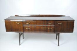 A Meredew dressing table, two drawers to the centre flanked by cupboards on either side,