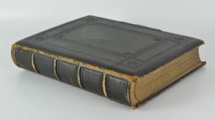 A late 19th century black and white photo album, containing mostly period portrait scenes,